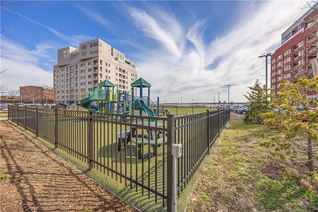 communal playground featuring fence