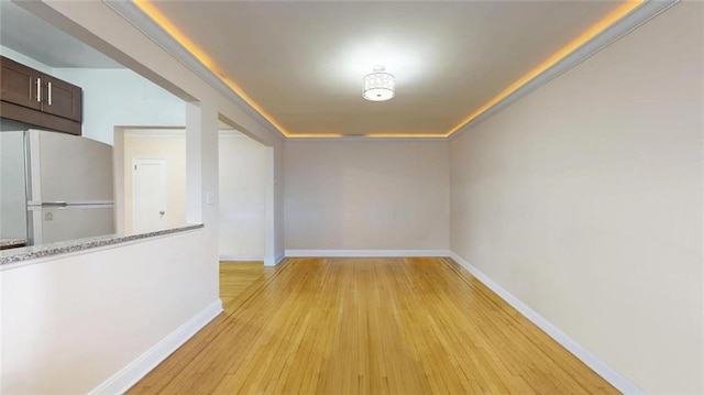 9281 Shore Rd Unit 220, Brooklyn, NY 11209 - unfurnished dining area with light wood-style flooring and baseboards