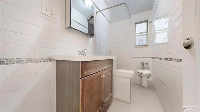 9281 Shore Rd Unit 220, Brooklyn, NY 11209 - bathroom featuring tile walls, toilet, and vanity