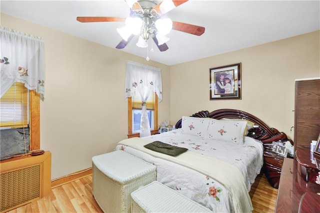 bedroom with wood finished floors and ceiling fan