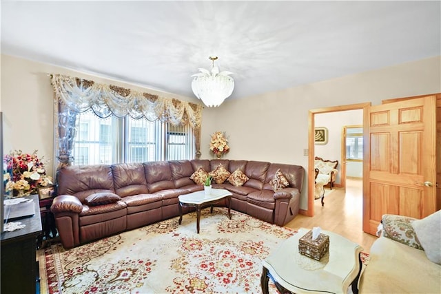 living room featuring a chandelier and wood finished floors