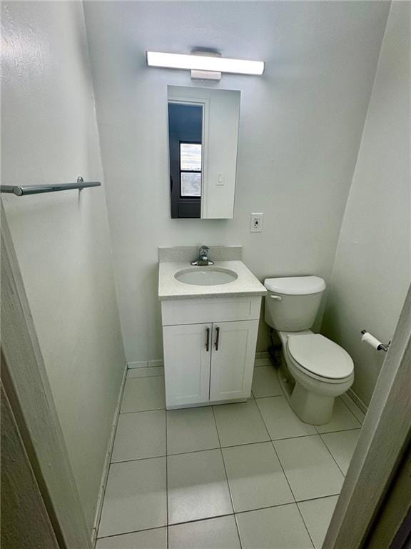 2800 Coyle St Unit 616, Sheepshead Bay, NY 11235 - bathroom featuring vanity, toilet, tile patterned flooring, and baseboards