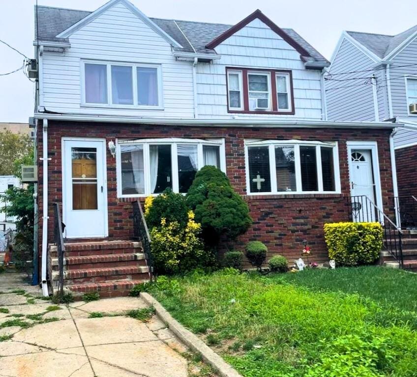 1664 E 35th St, Brooklyn, NY 11234 - view of front facade with brick siding and entry steps