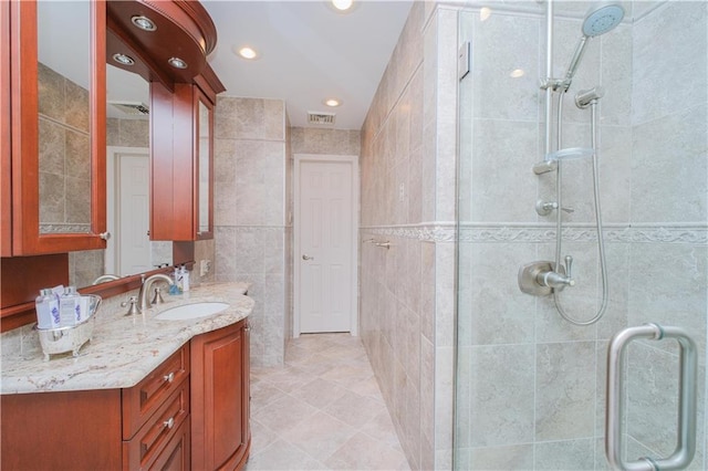 43 Fern Ave, Staten Island, NY 10308 - full bath featuring a stall shower, vanity, tile walls, recessed lighting, and tile patterned floors