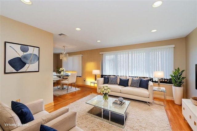 43 Fern Ave, Staten Island, NY 10308 - living area with light wood-type flooring, recessed lighting, a chandelier, and baseboards