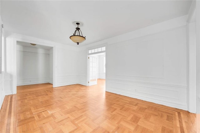 spare room with a decorative wall