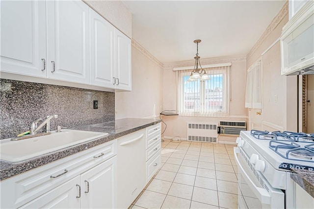 kitchen featuring a sink, radiator heating unit, white appliances, backsplash, and white cabinets