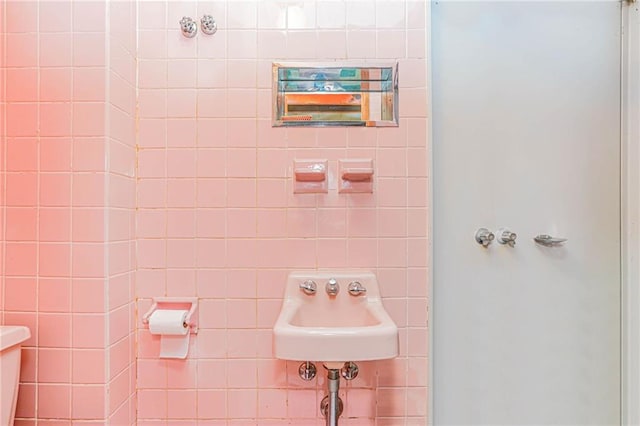 full bathroom with walk in shower and a sink