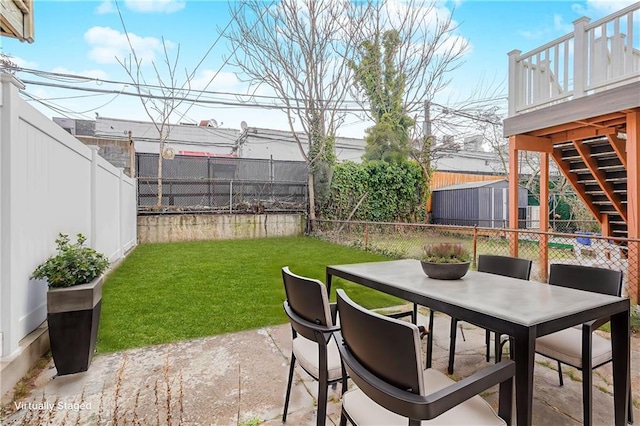 view of patio with stairs and outdoor dining space