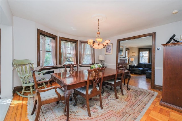 dining room with plenty of natural light and an inviting chandelier