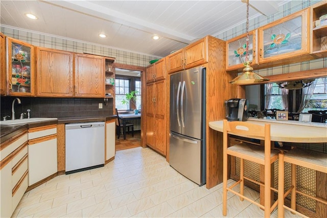 kitchen featuring open shelves, dark countertops, dishwasher, a sink, and freestanding refrigerator