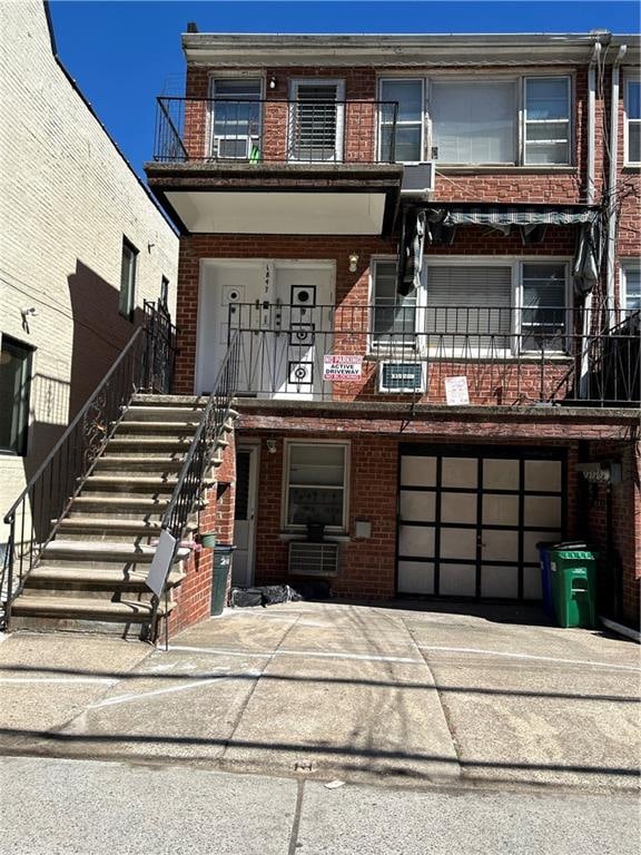 1847 E 13th St, Brooklyn, NY 11229 - multi unit property featuring brick siding, a garage, stairway, and driveway