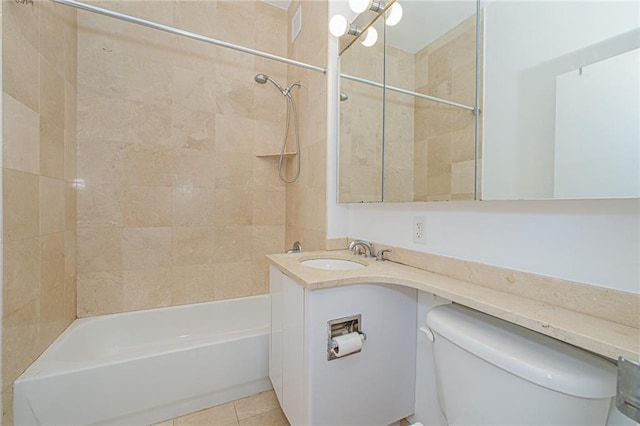 full bath featuring toilet, bathtub / shower combination, tile patterned floors, and vanity