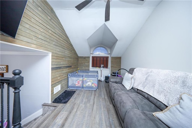 78 Darnell Ln, Staten Island, NY 10309 - living area with a ceiling fan, vaulted ceiling, wood finished floors, baseboards, and wooden walls