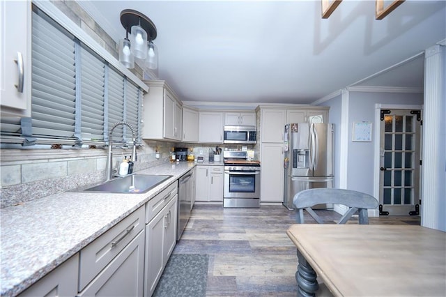 78 Darnell Ln, Staten Island, NY 10309 - kitchen featuring appliances with stainless steel finishes, a sink, light countertops, decorative backsplash, and wood finished floors