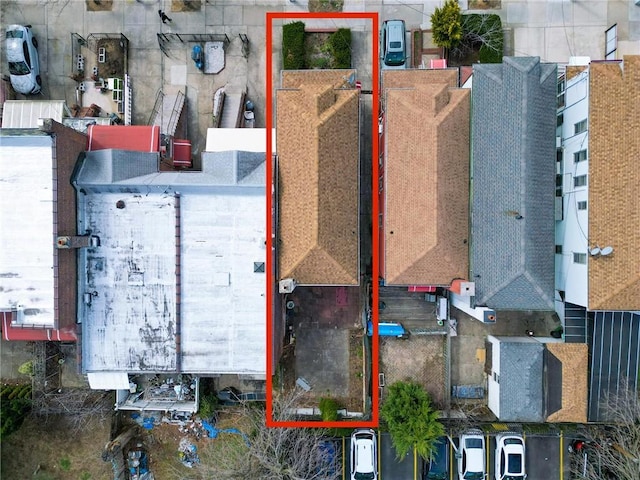 aerial view of property and surrounding area featuring property parcel outlined