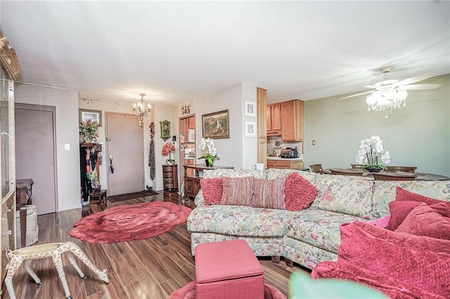 living area featuring a chandelier, wood finished floors, and a ceiling fan