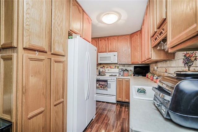 kitchen with white appliances, light countertops, dark wood finished floors, tasteful backsplash, and light brown cabinetry