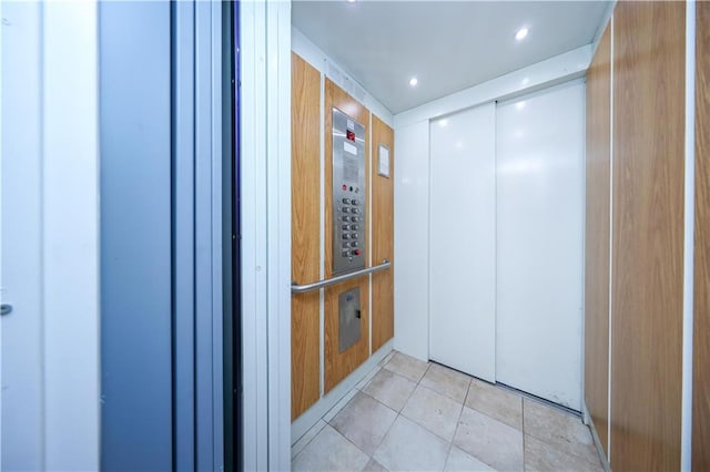 2679 E 24th St Unit 1B, Brooklyn, NY 11235 - corridor featuring recessed lighting and light tile patterned floors