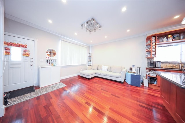 2679 E 24th St Unit 1B, Brooklyn, NY 11235 - living area featuring ornamental molding, wood finished floors, recessed lighting, and baseboards