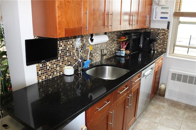 12399 Flatlands Ave Unit 6L, Brooklyn, NY 11207 - kitchen featuring a sink, dishwasher, brown cabinetry, radiator heating unit, and decorative backsplash