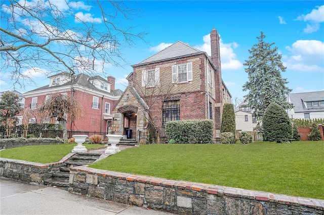8044 Narrows Ave, Brooklyn, NY 11209 - tudor home with brick siding and a chimney