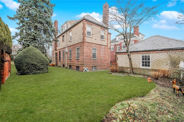 8044 Narrows Ave, Brooklyn, NY 11209 - back of house featuring a yard, brick siding, and a chimney