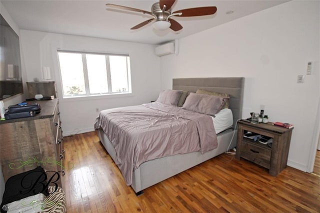 2070 Pearson St, Brooklyn, NY 11234 - bedroom with a wall mounted AC, light wood-style floors, and a ceiling fan