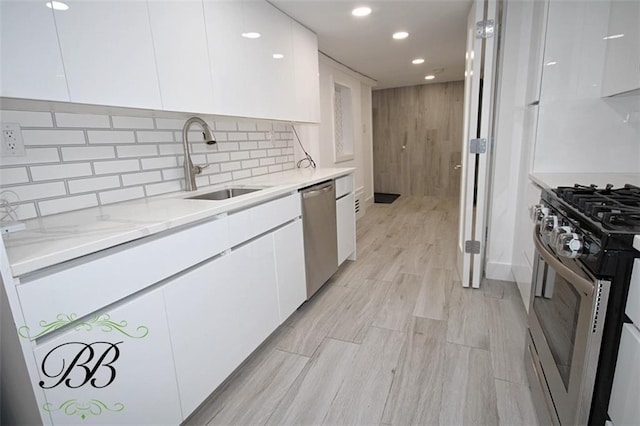 2070 Pearson St, Brooklyn, NY 11234 - kitchen featuring modern cabinets, appliances with stainless steel finishes, a sink, white cabinets, and recessed lighting