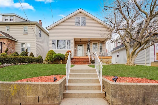 view of front of house featuring a front yard and covered porch