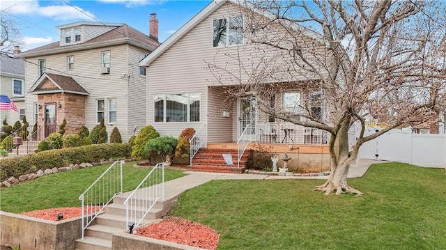 american foursquare style home featuring a chimney