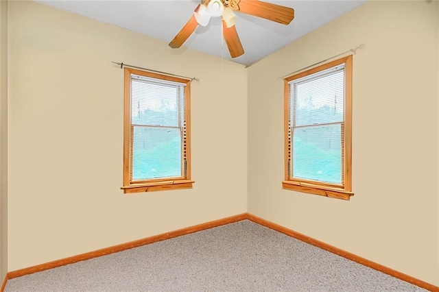 empty room featuring healthy amount of natural light and carpet flooring