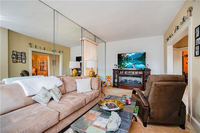 living area featuring light colored carpet