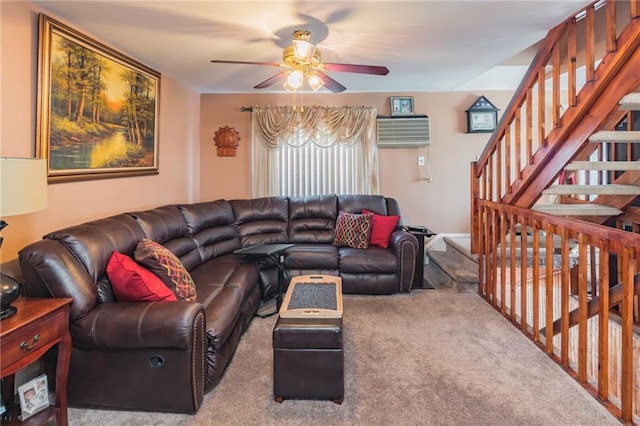 living room with carpet flooring, stairs, and ceiling fan
