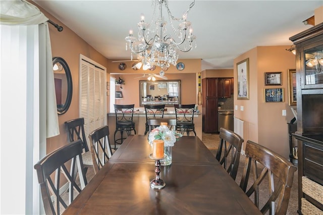 dining room featuring a notable chandelier