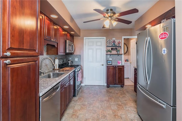 kitchen with open shelves, a sink, decorative backsplash, a ceiling fan, and appliances with stainless steel finishes