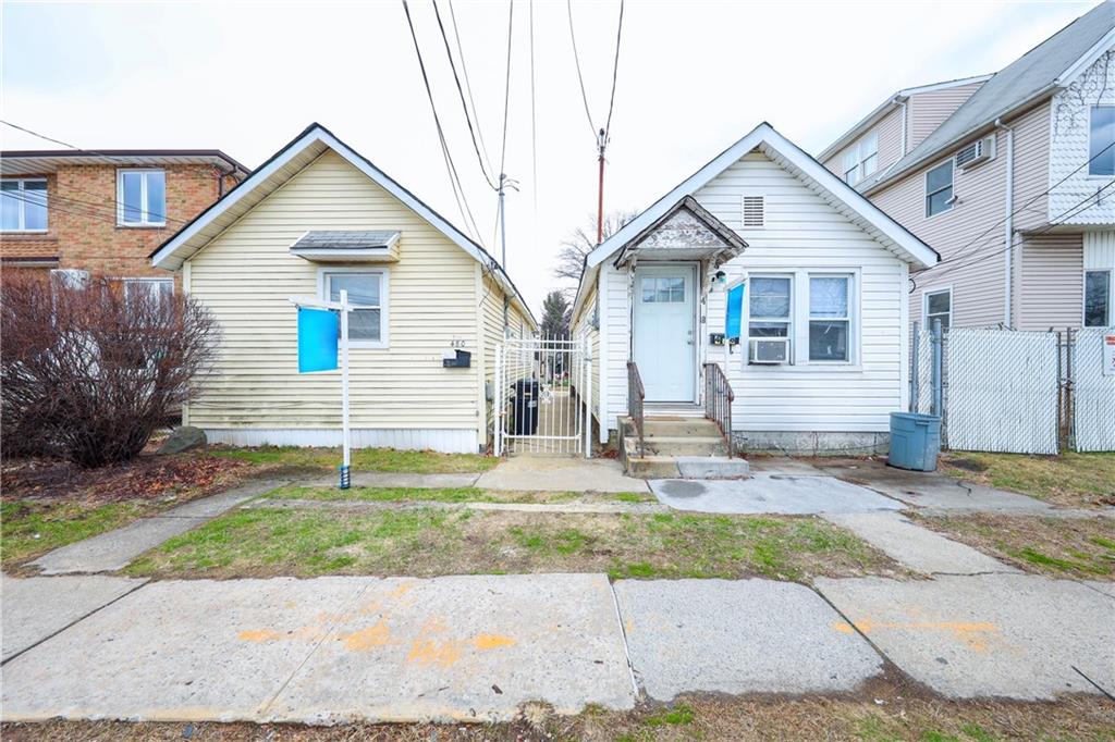 480 Midland Ave, Staten Island, NY 10306 - view of front of home with entry steps, cooling unit, and a gate