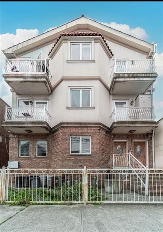 2841 Ford St Unit 1R, Brooklyn, NY 11235 - view of building exterior with a fenced front yard