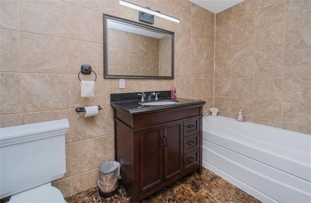 2841 Ford St Unit 1R, Brooklyn, NY 11235 - full bathroom with tile walls, toilet, a tub to relax in, marble finish floors, and vanity