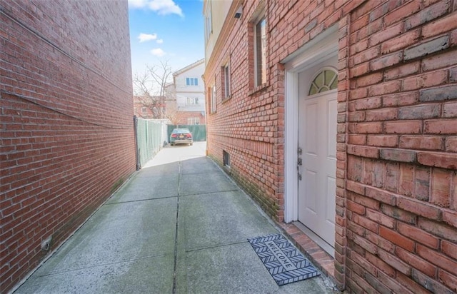 2841 Ford St Unit 1R, Brooklyn, NY 11235 - view of side of home with brick siding and fence