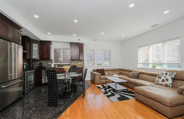 2841 Ford St Unit 1R, Brooklyn, NY 11235 - living room with recessed lighting and wood finished floors