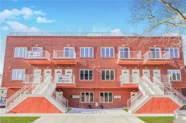 view of property featuring stairway