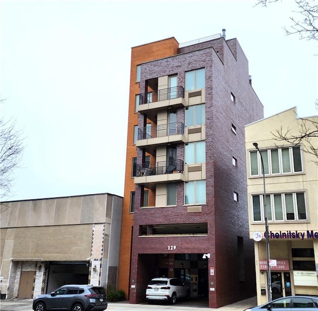 129 W End Ave Unit 3B, Brooklyn, NY 11235 - view of apartment building / complex with a garage