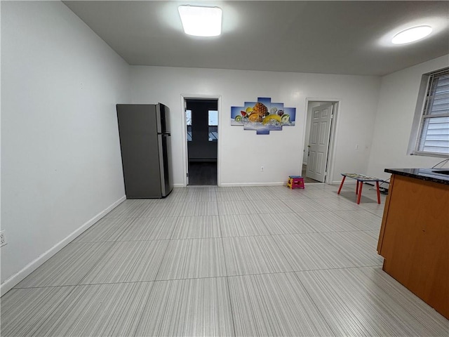 interior space featuring baseboards