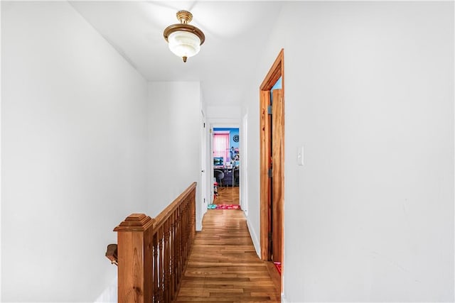 corridor featuring wood finished floors