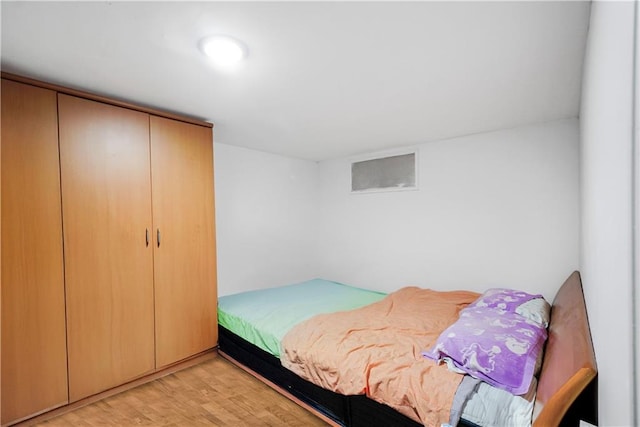 bedroom with light wood-type flooring