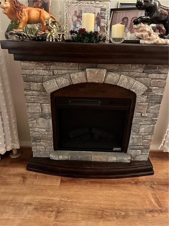 956 E 48th St, Brooklyn, NY 11203 - detailed view of a fireplace, wood finished floors, and baseboards