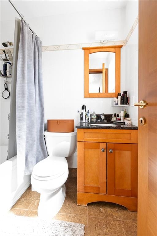 full bathroom with toilet, vanity, tile patterned flooring, and shower / tub combo with curtain