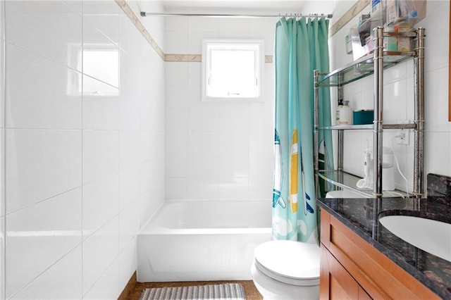 full bathroom featuring toilet, vanity, and shower / bathtub combination with curtain