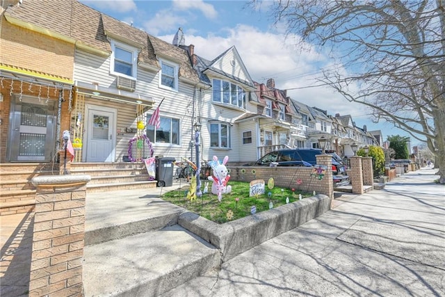 back of property with a residential view